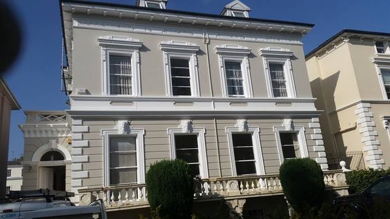 The front of a house newly painted 